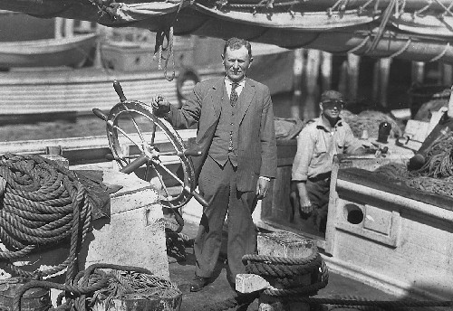 Captain Charles “Blossom” Colson at the wheel of the Natalie Hammond